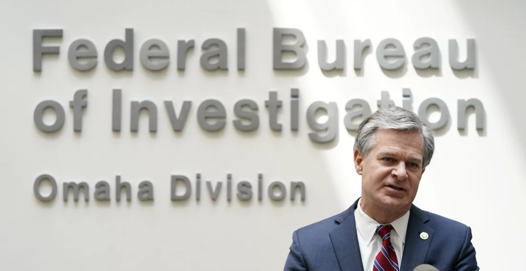 FBI Director Christopher Wray Resigns Just Before Trump's Inauguration in January. (Image Credit: Charlie Neibergall / AP)
