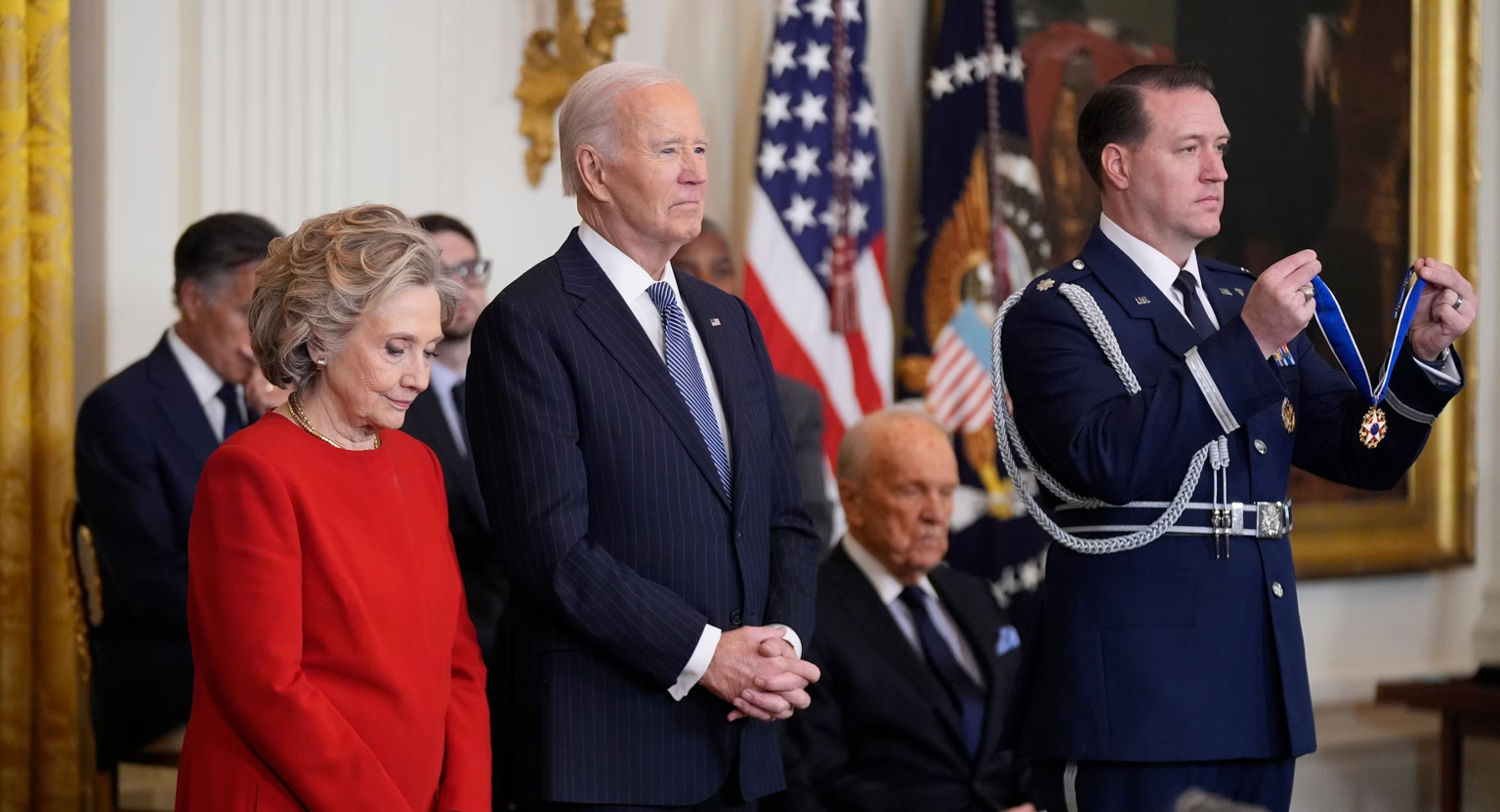President Joe Biden, center, prepares to present the Presidential Medal of Freedom, the Nation's highest civilian honor, to 19 recipients. (Image Credit: Manuel Balce Ceneta / AP)