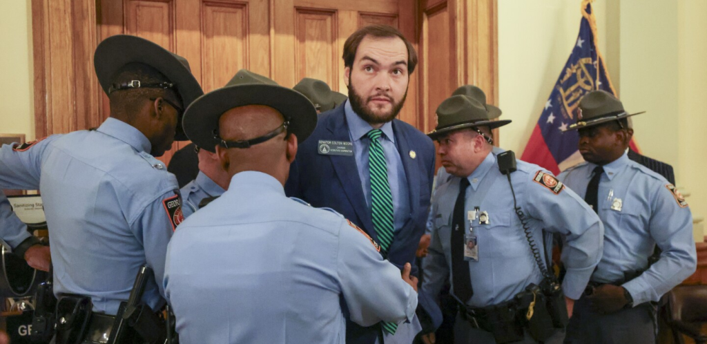 Senator Colton Moore Arrested Trying to Enter House Chamber Georgia Senator Colton Moore Arrested for Defying House Chamber Ban. (Image Credit: (Jason Getz via Atlanta Journal-Constitution / AP)