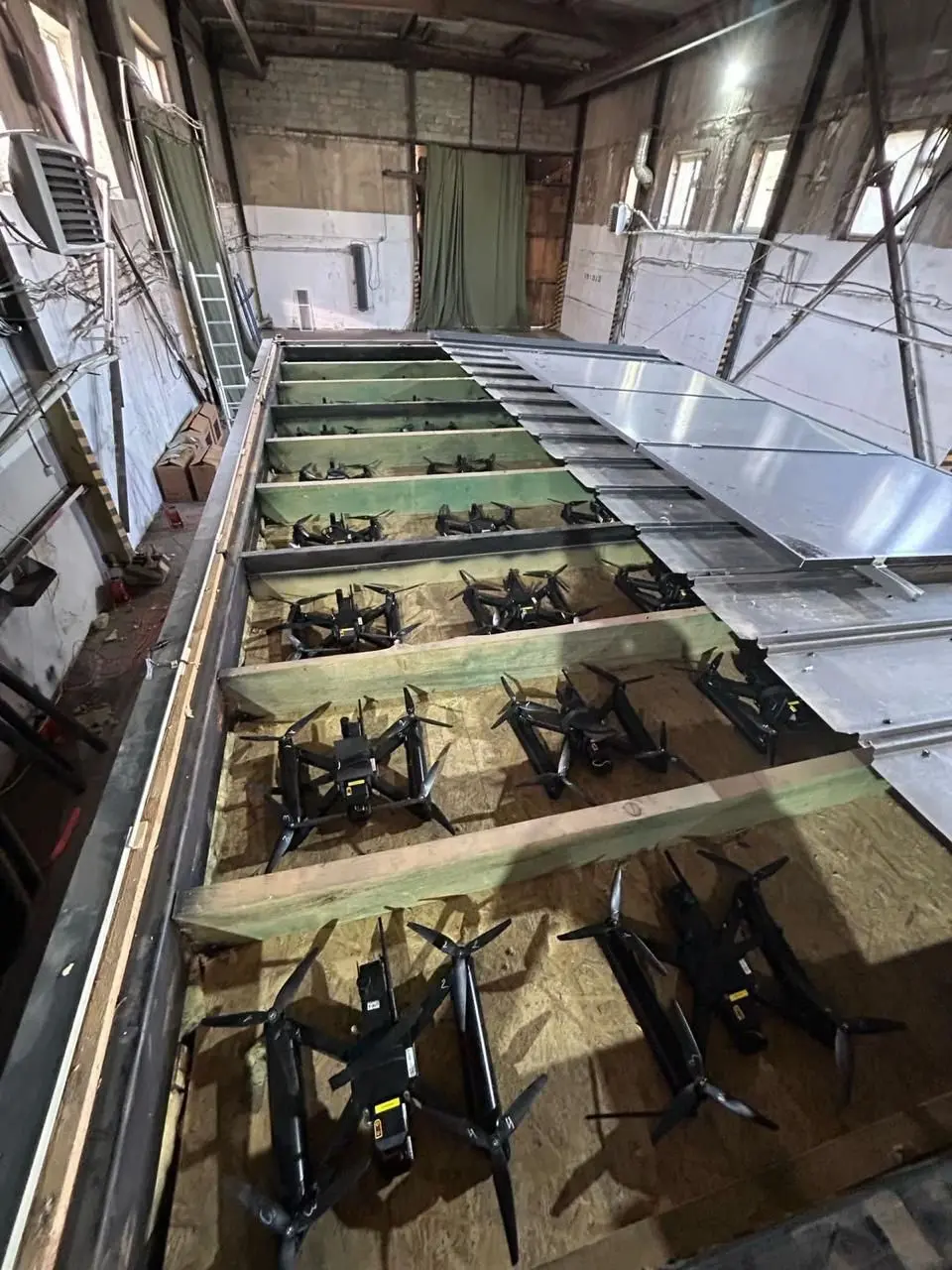 The drones were concealed in the ceilings of transportation containers that were opened remotely for the assault. (Image Credit: SECURITY SERVICE OF UKRAINE/AFP)