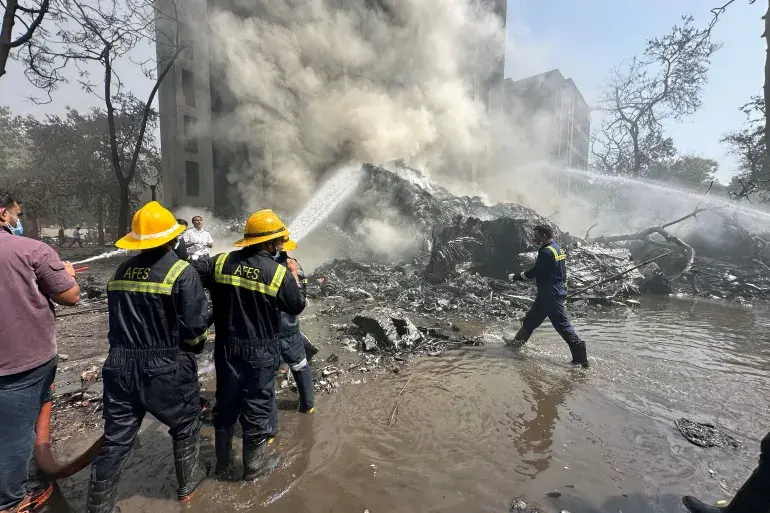 Rescuers work as smoke rises at the site where an Air India plane crashed in Ahmedabad, India, on June 12, 2025 (Image Credit: Amit Dave/Reuters)