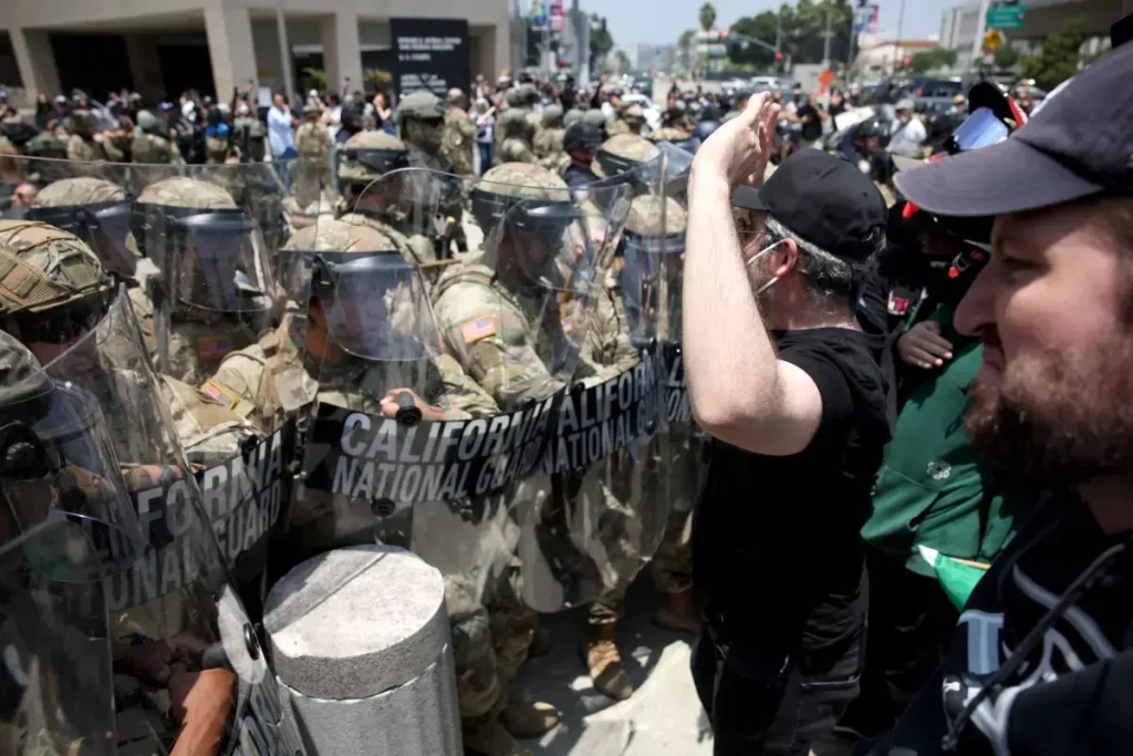 LA Riots with National Guard troops outside the Metropolitan Detention Center in downtown Los Angeles on Sunday. (Image Credit: Jason Armond/Los Angeles Times)