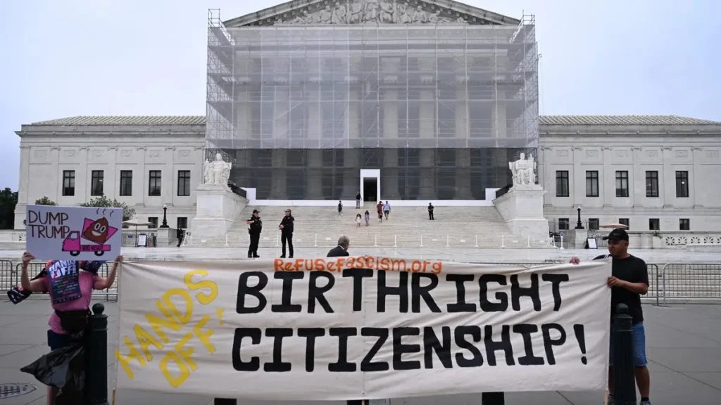 Demonstrators hold up an anti-Trump sign as U.S. Supreme Court sided with President Trump on what is Birthright Citizenship in Washington, DC, on 27 June 27 2025 (Image Credit: Alex Wrobleski/AFP)