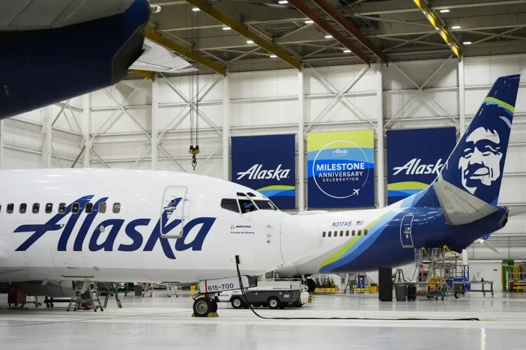 Alaska Airlines Grounded Nationwide Due To IT Outage Alaska Airlines Grounds Entire Fleet Due to IT Outage; Operations Resume After Three-Hour Delay. (Image Credit: Lindsey Wasson/AP)