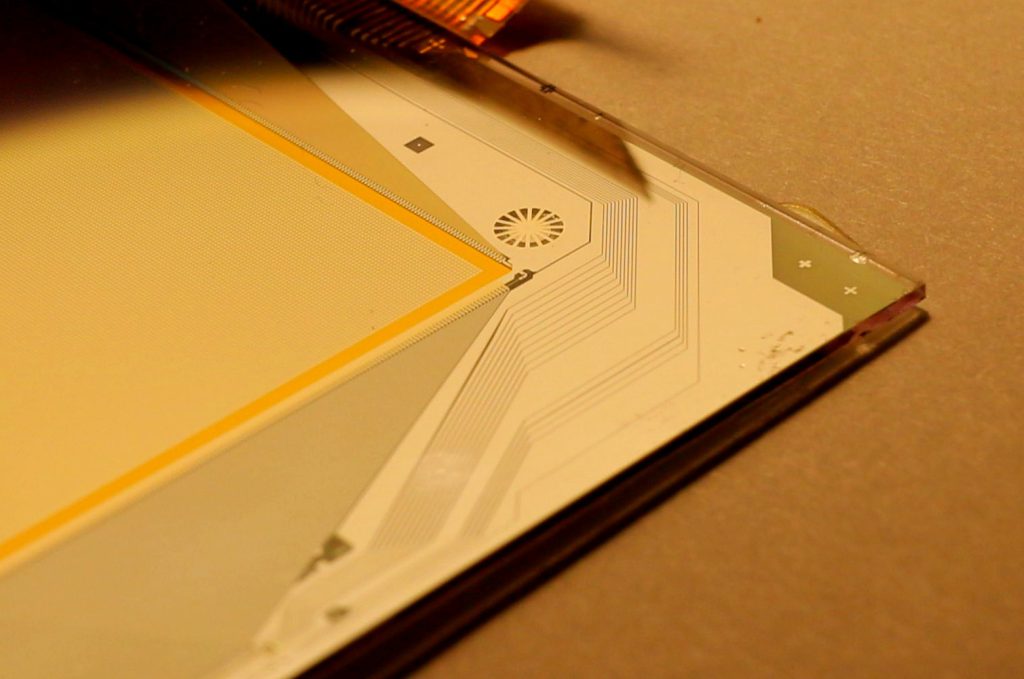 Close up of E Ink Kaleido 4 color e-paper screen displaying vibrant text and images