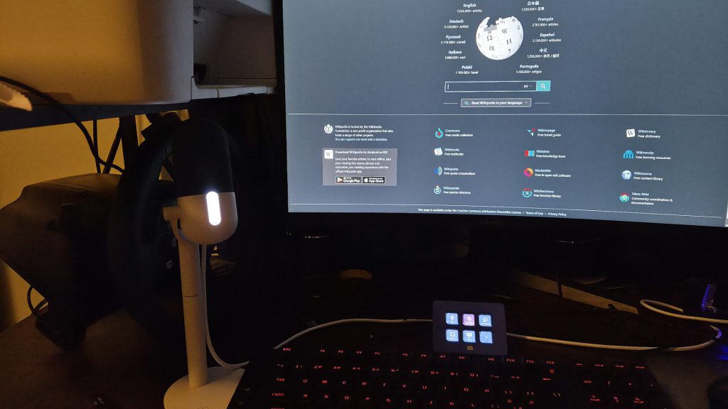 Elgato Wave Go wireless microphone clipped to a shirt collar