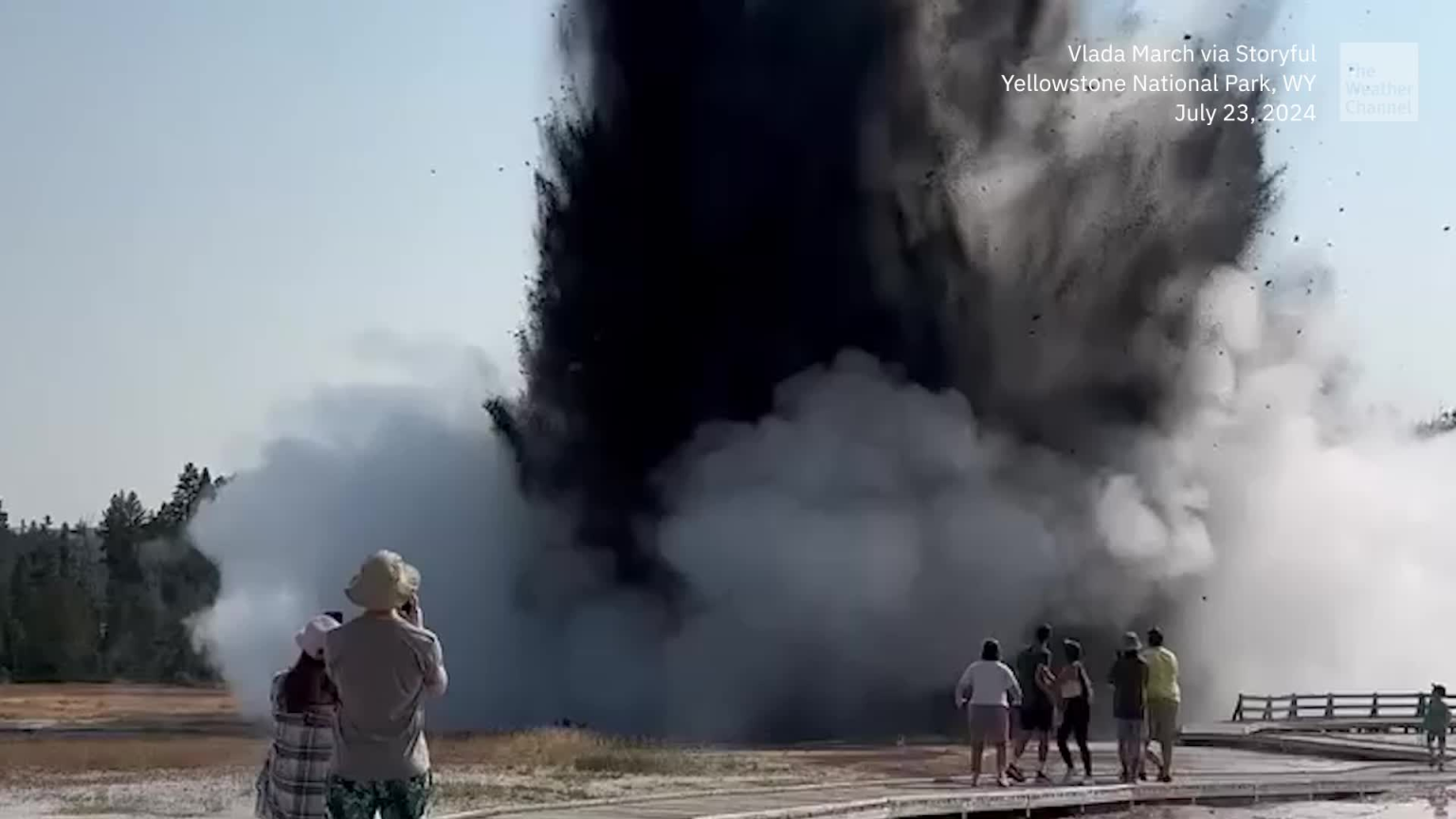 Visitors to Biscuit Basin run along the boardwalk to escape a large hydrothermal explosion near Black Diamond Pool on Tuesday in Yellowstone National Park. (Credit: Vlada March)