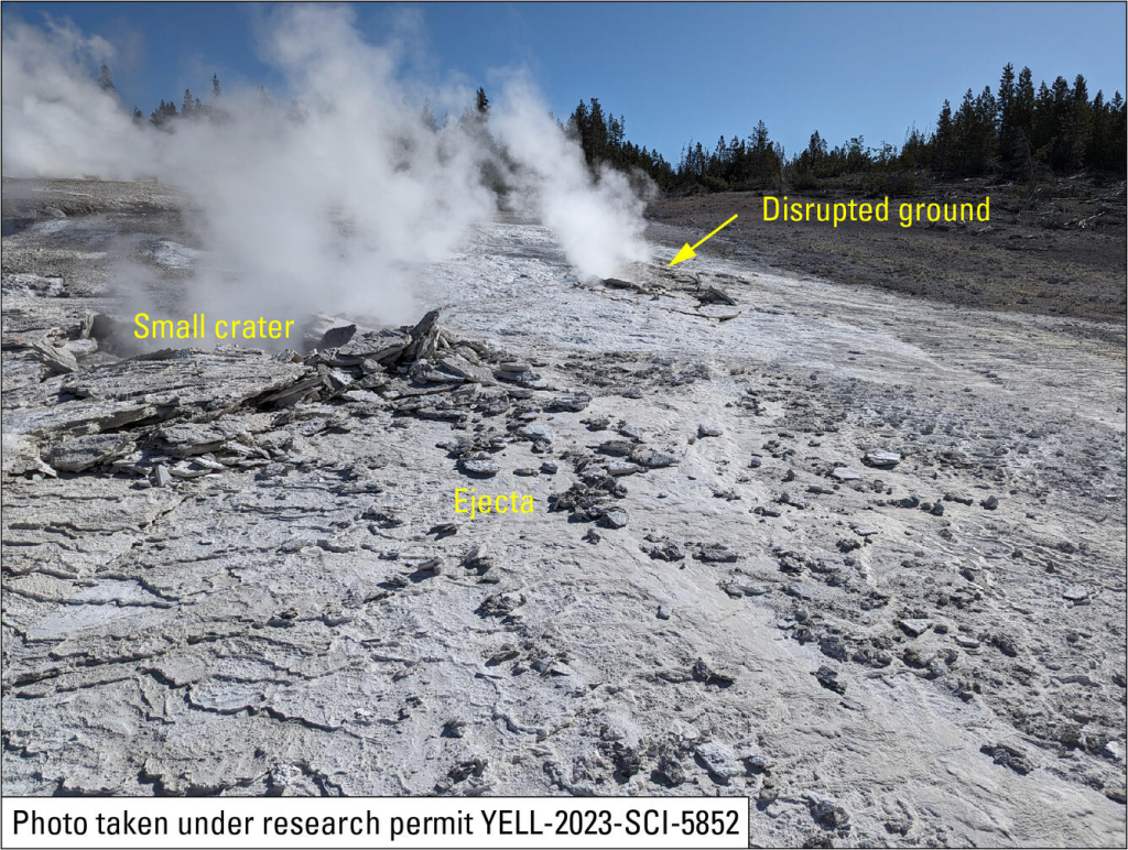 Hydrothermal Explosion in Yellowstone's Biscuit Basin 2 Site of April 15, 2024, hydrothermal explosion on Porcelain Terrace, Norris Geyser Basin, Yellowstone National Park. The small crater (just a few feet, or 1-2 meters, across) and disrupted ground are in silica sinter deposits that formed in the past two years, since water has been flowing from the terrace into Nuphar Lake (off photo to right), and angular fragments of ejecta on top of the sinter are evidence that the crater formed due to a small explosion. (Source: USGS photo by Mike Poland, May 18, 2024)