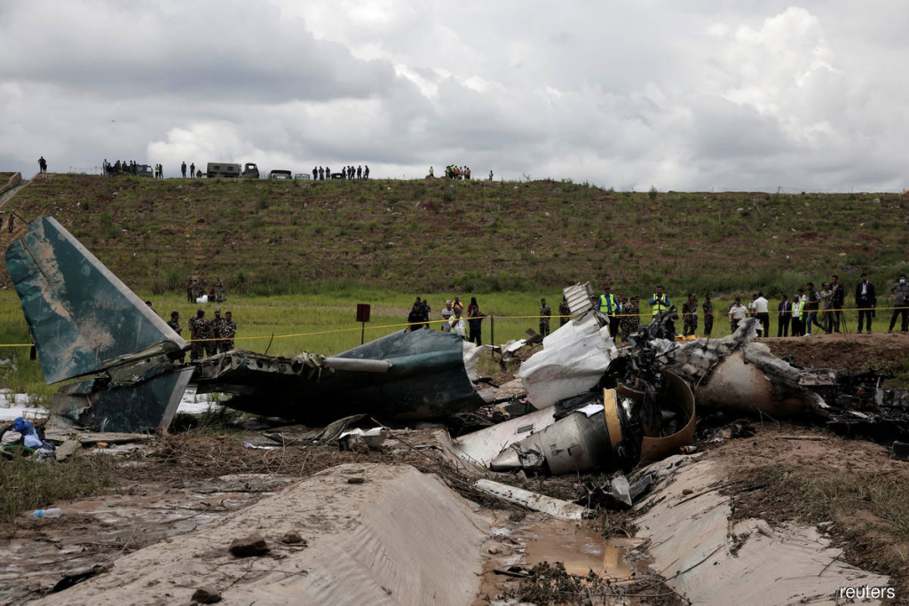 Nepal’s Plane Crash at Tribhuvan International Airport: Fatal Incident in Kathmandu The wreckage of the Saurya Airlines plane that caught fire after skidding off the runway while taking off at Tribhuvan International Airport, in Kathmandu, Nepal on Wednesday. (Credit: Reuters)