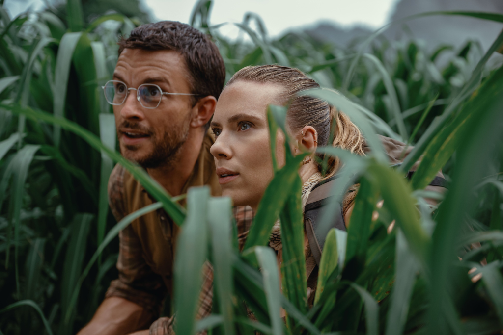Jurassic World Rebirth Trailer: New Era, Cast, and Dinosaurs 2 Jonathan Bailey as paleontologist Dr. Henry Loomis and Scarlett Johansson as covert operations expert Zora Bennett in "Jurassic World Rebirth" (Image Credit: Universal Pictures)