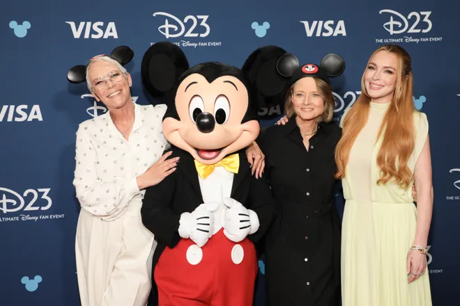 Miley Cyrus Makes History as Youngest Disney Legend at D23 Expo 2024 3 Jodie Foster gave Jamie Lee Curtis an OG Mickey Mouse hat when presenting the "Freaky Friday" star with the Disney Legend award. Lindsay Lohan (right) also presented the award to her "Freakier Friday" co-star. (Credit: Group LA / The Walt Disney Company)
