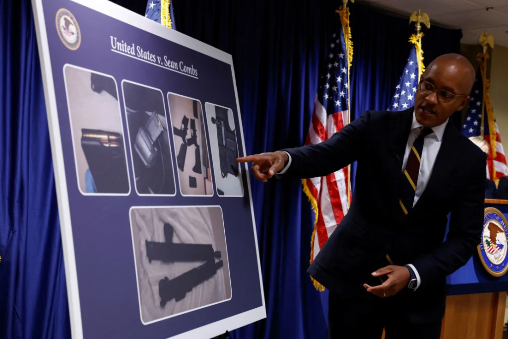 Sean "Diddy" Combs And The 1,000 Bottles Of Baby Oil: A Closer Look At The Indictment 2 U.S. Attorney Damian Williams pointed at a chart Tuesday showing the firearms seized during the search of Sean "Diddy" Combs' homes, as well as more than 1,000 bottles of baby oil and lubricant. (Image Credit: Shannon Stapleton / Reuters)