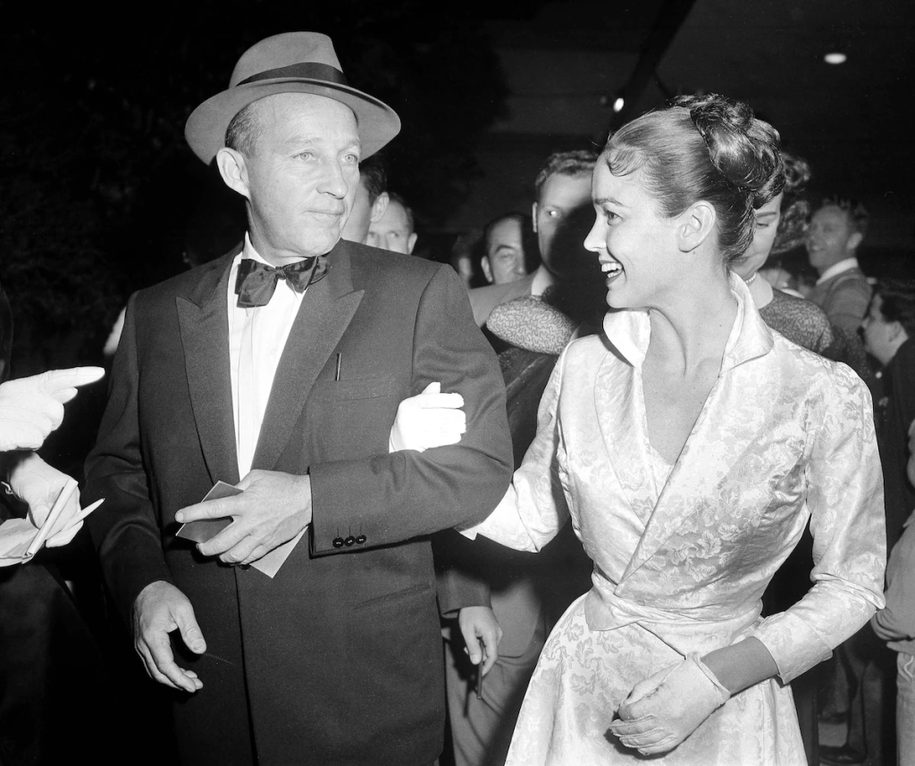 Kathryn Crosby, Actress And Widow Of Bing Crosby, Dies At 90 1 Bing Crosby and his wife, Kathryn Crosby, arrive for the premiere of “The Bridge on the River Kwai” in Hollywood on December 19, 1957. (Image Credit: Harold P. Matosian)