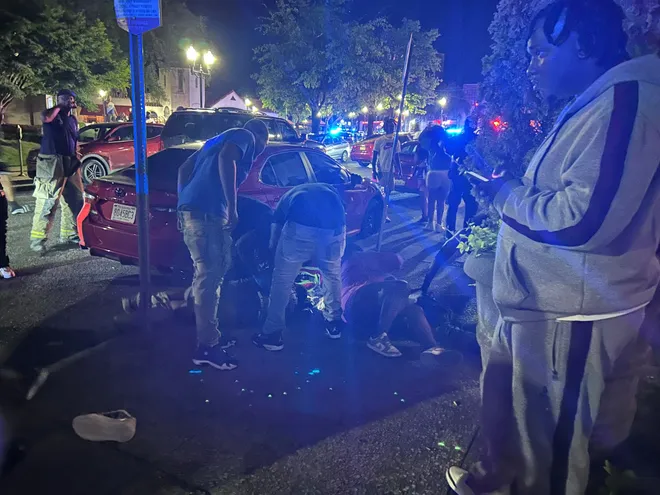 Birmingham Mass Shooting: 4 Dead, 21 Injured in Targeted Attack 1 Victims can be seen lie on the ground as first responders and medical staff arriving at the Birmingham Mass Shooting outside Hush, a hookah and cigar lounge. (Image Credit: Drew Hawkins / Reuters)