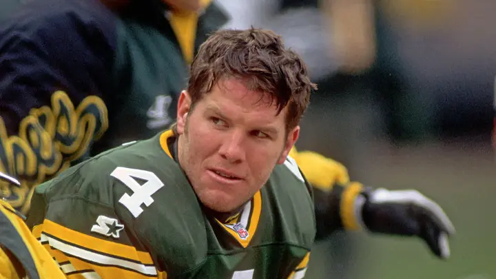 Brett Favre’s Parkinson: Challenge For The NFL Legend 2 NFL Legend Brett Favre #4 of the Green Bay Packers looks on from the sideline during a game against the Cleveland Browns at Cleveland Municipal Stadium on Nov. 19, 1995, in Cleveland, Ohio. (Getty Images)
