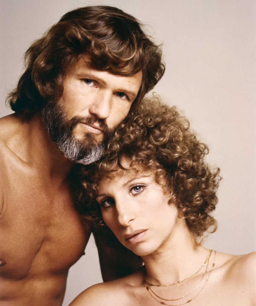 Kris Kristofferson, Legendary Singer-Songwriter And Actor, Dies At 88 2 Kris Kristofferson and Barbra Streisand on the set of "A Star is Born" (1976). (Credit: Getty Images)