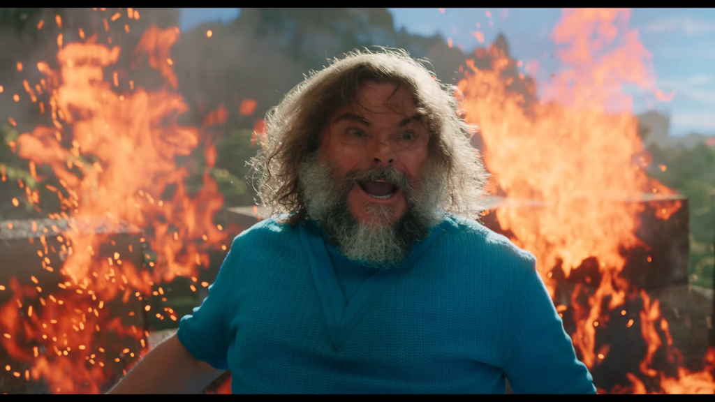 First Official ‘Minecraft Movie’ Trailer Sparks Controversy 3 Jack Black as Steve in his iconic blue shirt, and a not-so-iconic hairstyle. (Image Credit: Warner Bros.)