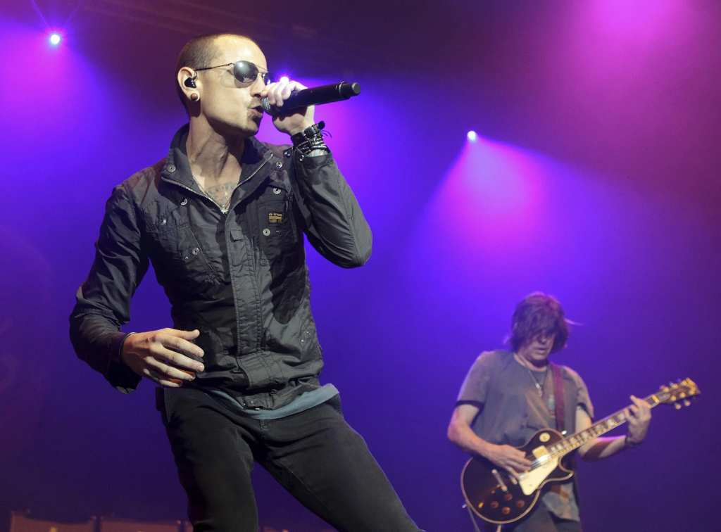 Linkin Park Welcomes Emily Armstrong as New Lead Singer 2 Chester Bennington, left, at the MMRBQ Music Festival 2015 at the Susquehanna Bank Center in Camden, N.J., on May 16, 2015. (Image Credit: Owen Sweeney/Invision/AP, File)