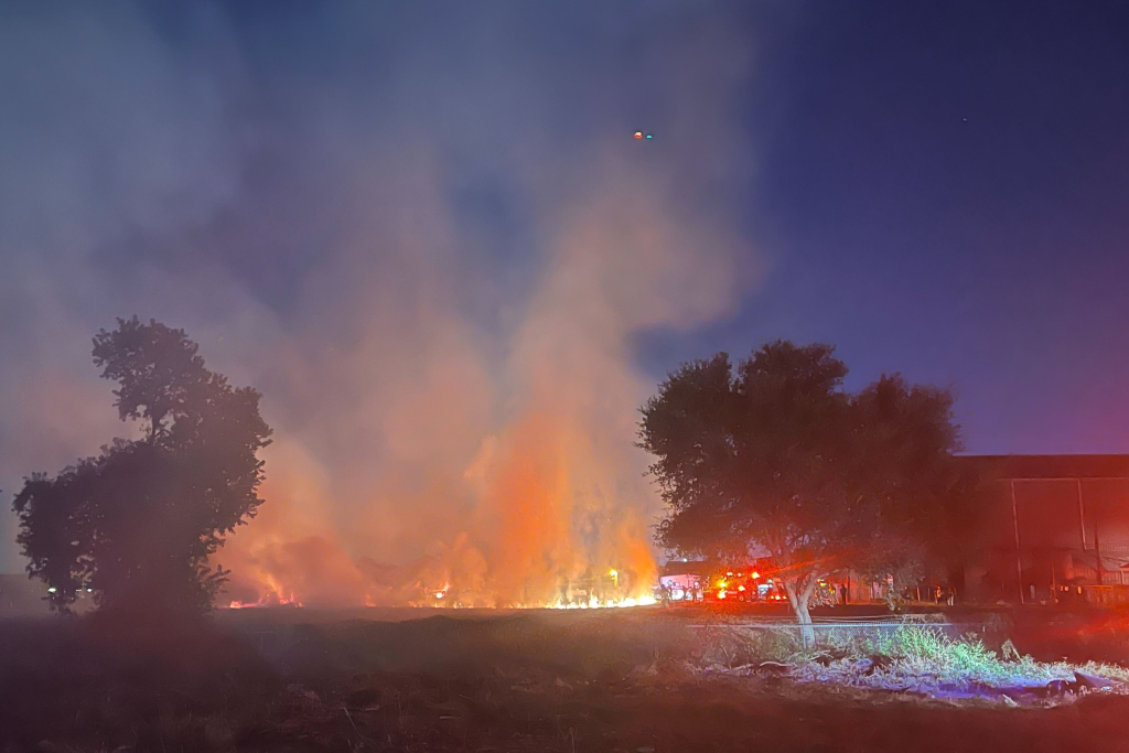Tragic Houston Helicopter Crash: Multiple Fatalities, Including A Child 2 Smoke and fire filled the air at the helicopter crash site, as local authorities trying to keep onlookers safe. (Image Credit: Liam Coghlan)