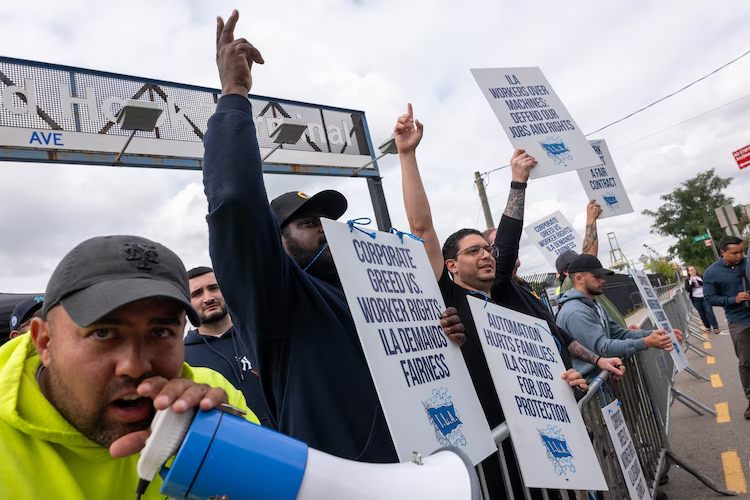Port Strike 2024 Ends As Workers Agree To Wage Deal 1 Striking workers at the Red Hook Container Terminal in Brooklyn gather after members of the International Longshoremen's Association (ILA), began the port strike on, Oct. 2, 2024, in Brooklyn, New York. (Credit: Spencer Platt/Getty Images)