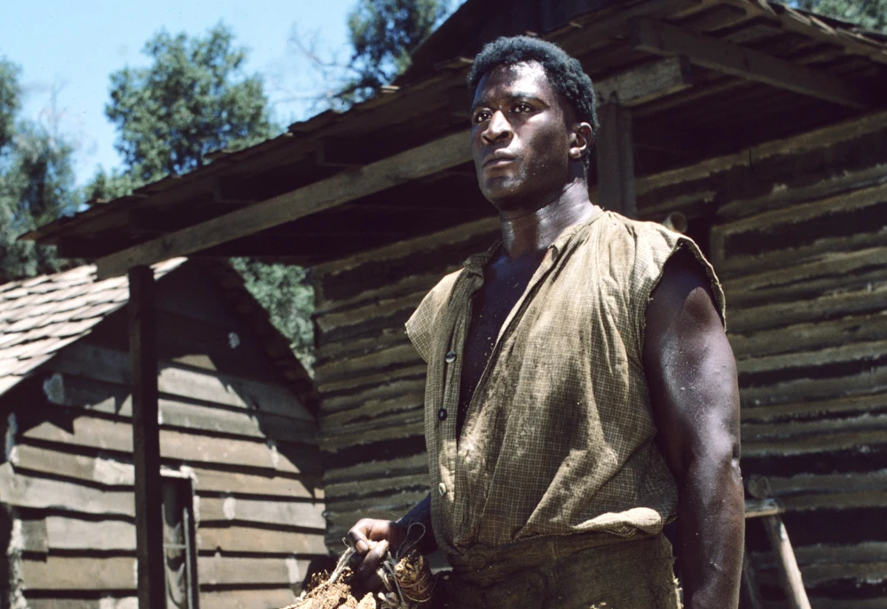 John Amos, Iconic Star of ‘Good Times’ and ‘Roots,’ Passes Away at 84 3 John Amos as adult Kunta Kinte in "Roots." (Credit: Disney General Entertainment Content via Getty Images)