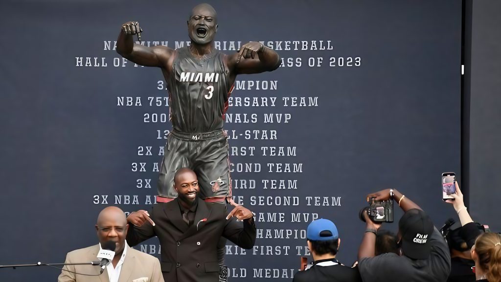 Dwyane Wade Statue Reveal: Honoring "This is My House" Moment 1 The former Heat star poses with his This is my house Dwyane Wade statue unveiling ceremony outside Kaseya Center in Miami on Sunday. (Image Credit: Michael Laughlin / AP)