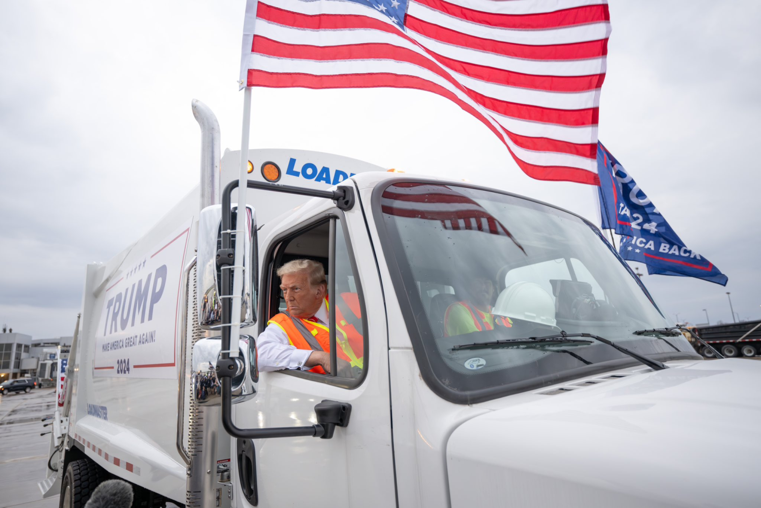 Trump Rolling Up in a Garbage Truck in Wisconsin former President Donald Trump in garbage truck as he talks to reporters Wednesday, Oct. 30, 2024, in Green Bay, Wis.  (Image Credit: Dan Scavino Jr.)