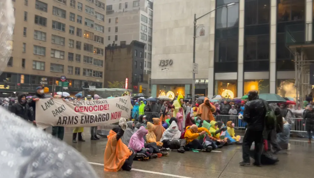 Thanksgiving parade protest during the 98th Macy’s Thanksgiving Day Parade in New York City, U.S., November 28, 2024. (Image Credit: Zoe Hussain / NY POST)