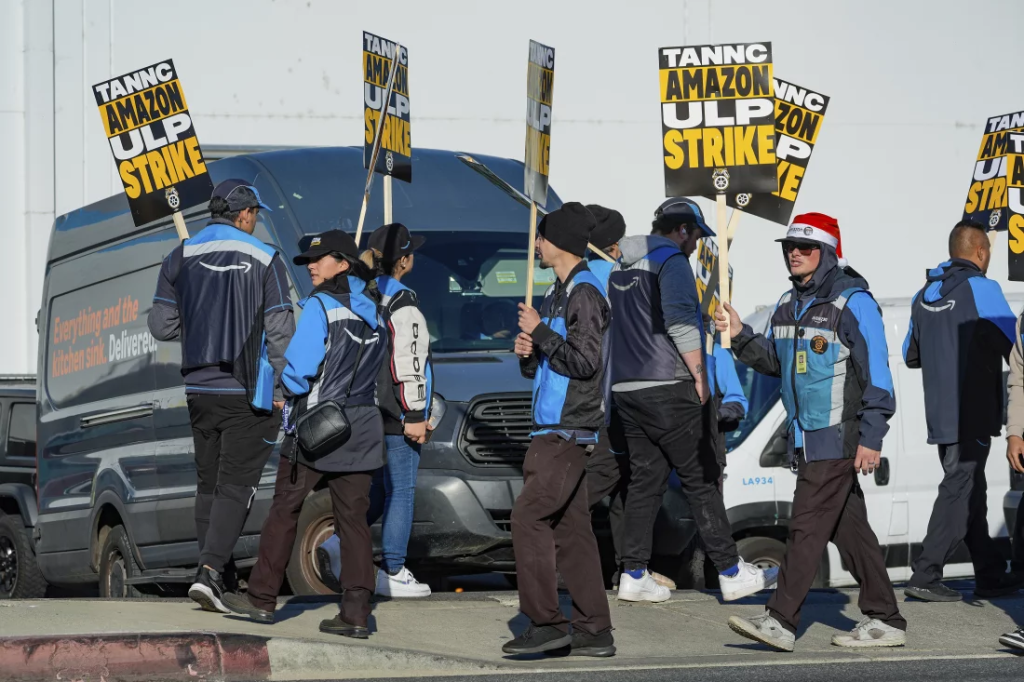 Amazon Workers Strike At Holiday Rush: What You Need to Know 1 Amazon strike by workers outside an Amazon fulfillment center in City of Industry, California on Thursday. (Image Credit: Damian Dovarganes / AP)