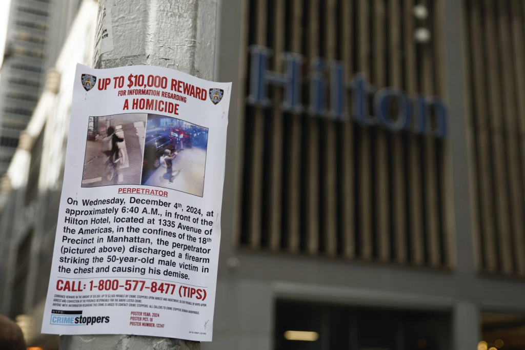 A reward poster for information about the UnitedHealthcare CEO killed on Wednesday, Dec. 4, 2024, in New York. (Image Credit: Stefan Jeremiah / AP)