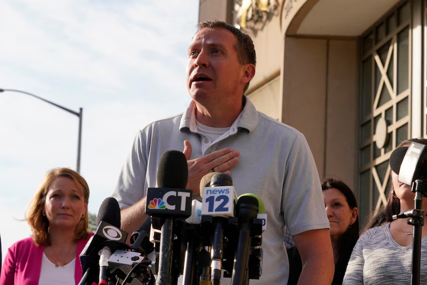 Robbie Parker, father of a victim that was killed in the Sandy Hook Elementary School Shooting, welcomed the Infowars auction. (Image Credit:Michelle McLoughlin / Reuters)
