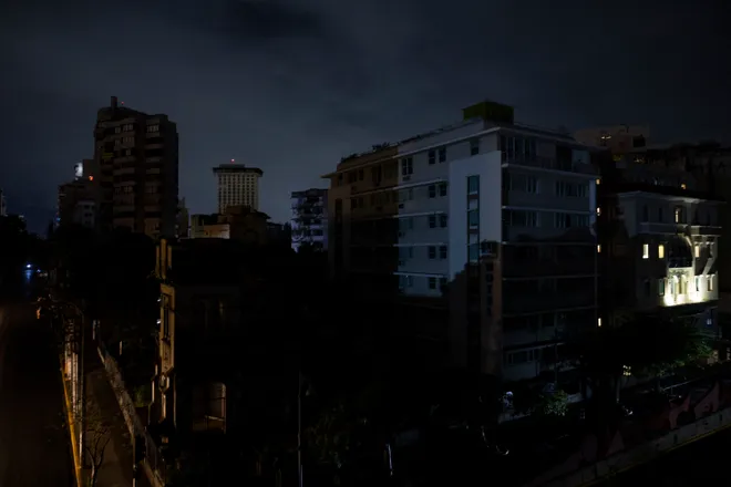 New Year’s Eve Blackout Leaves Puerto Rico in the Dark 1 Buildings in the dark in San Juan after Puerto Rico without power hit the island on Dec. 31, 2024. (Credit: RICARDO ARDUENGO / AFP via Getty Images)