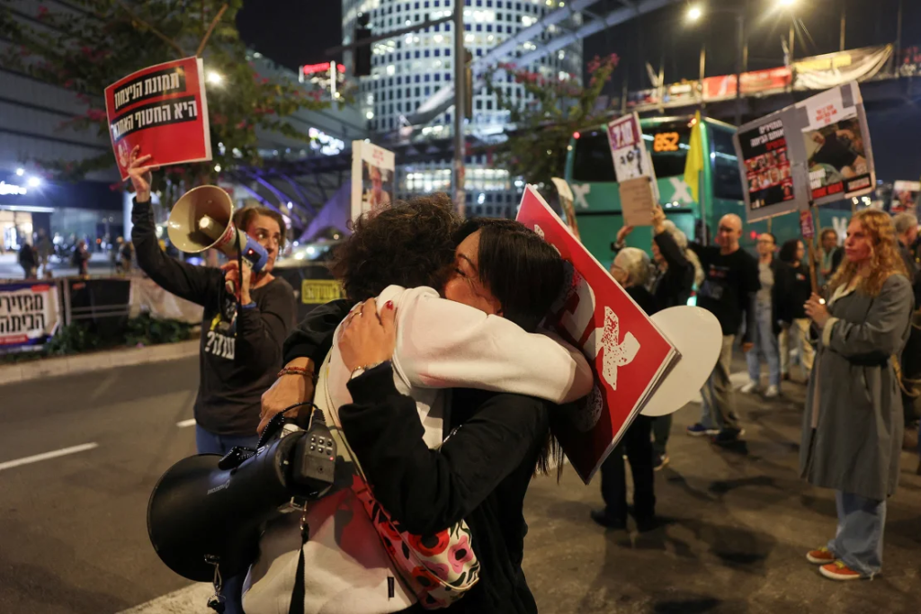Ceasefire in Gaza: What It Means and What Happens Next 1 Israeli hostages supporters react to the ceasefire Gaza news in Tel Aviv, Israel, January 15, 2025. (Image Credit: Ronen Zvulun / Reuters)