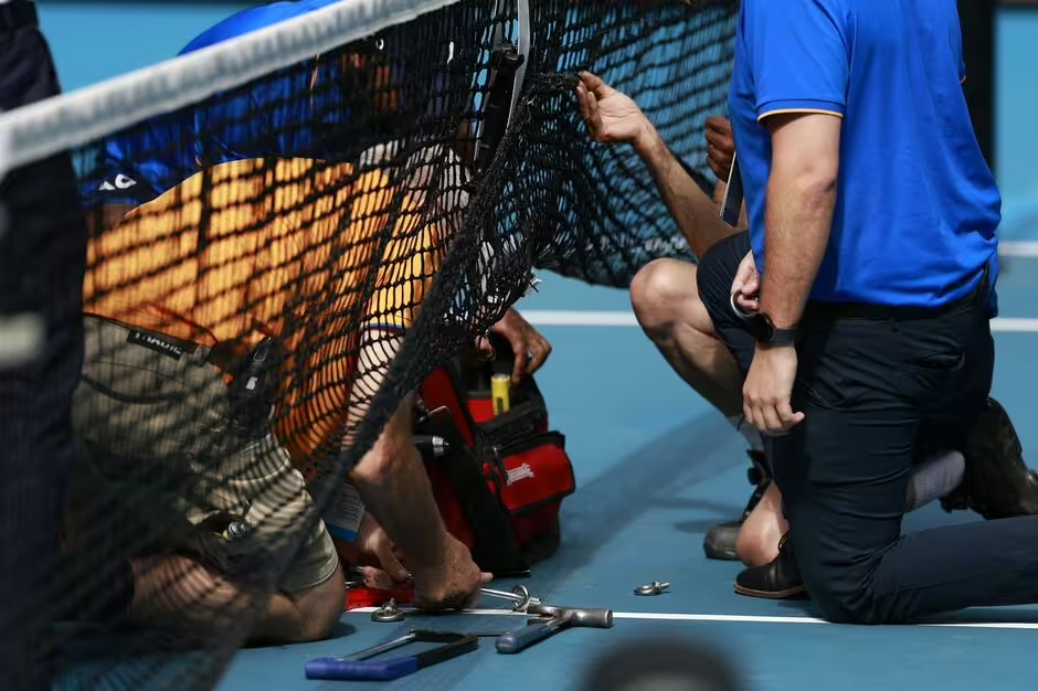The match between Sinner and Rune was suspended as repair staffs were called in when the net snapped out of the court. (Credit: Getty Images)