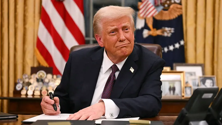 President Donald Trump signing executive actions and orders on Jan. 20, 2025, after he was sworn in as the nation's 47th president, including ones related to DEI. (Credit: Getty Images)