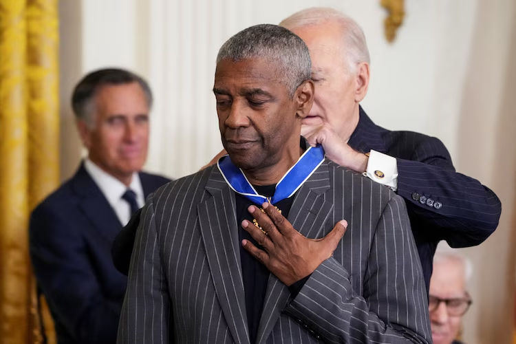 Who Are The Presidential Medal of Freedom Recipients 2025? 7 President Joe Biden presents the Presidential Medal of Freedom to Actor Denzel Washington during a ceremony in the East Room of the White House, in Washington,D.C., Jan. 4, 2025. (Image Credit: Ken Cedeno / Reuters)