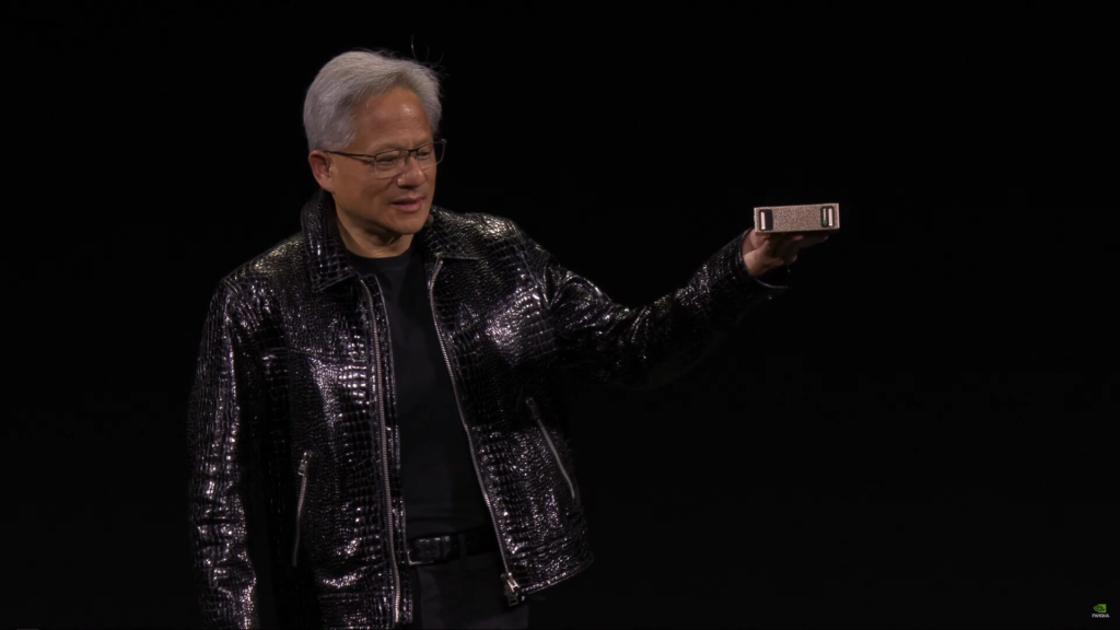 NVIDIA CES 2025 Keynote: RTX 50 Series, AI and More 8 NVIDIA's CEO Jensen Huang holding in his hand a compact AI supercomputer called Project DIGITS. (Image Source: NVIDIA)