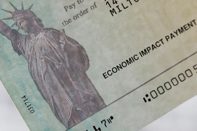 Are You Eligible for $1,400 IRS Stimulus Checks? 1 A family's stimulus check from the U.S. Treasury for the coronavirus disease (COVID-19) aid. (Image Credit: Brian Snyder / Reuters)