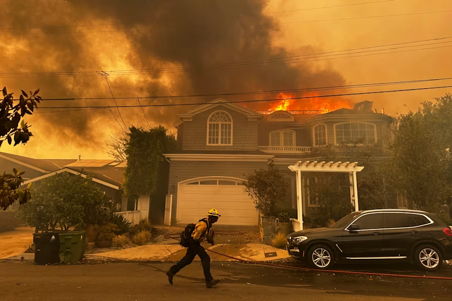 Firefighter battles the Palisades Fire in the Pacific Palisades neighborhood of Los Angeles Tuesday, Jan. 7, 2025. (Image Credit: Eugene Garcia / AP)