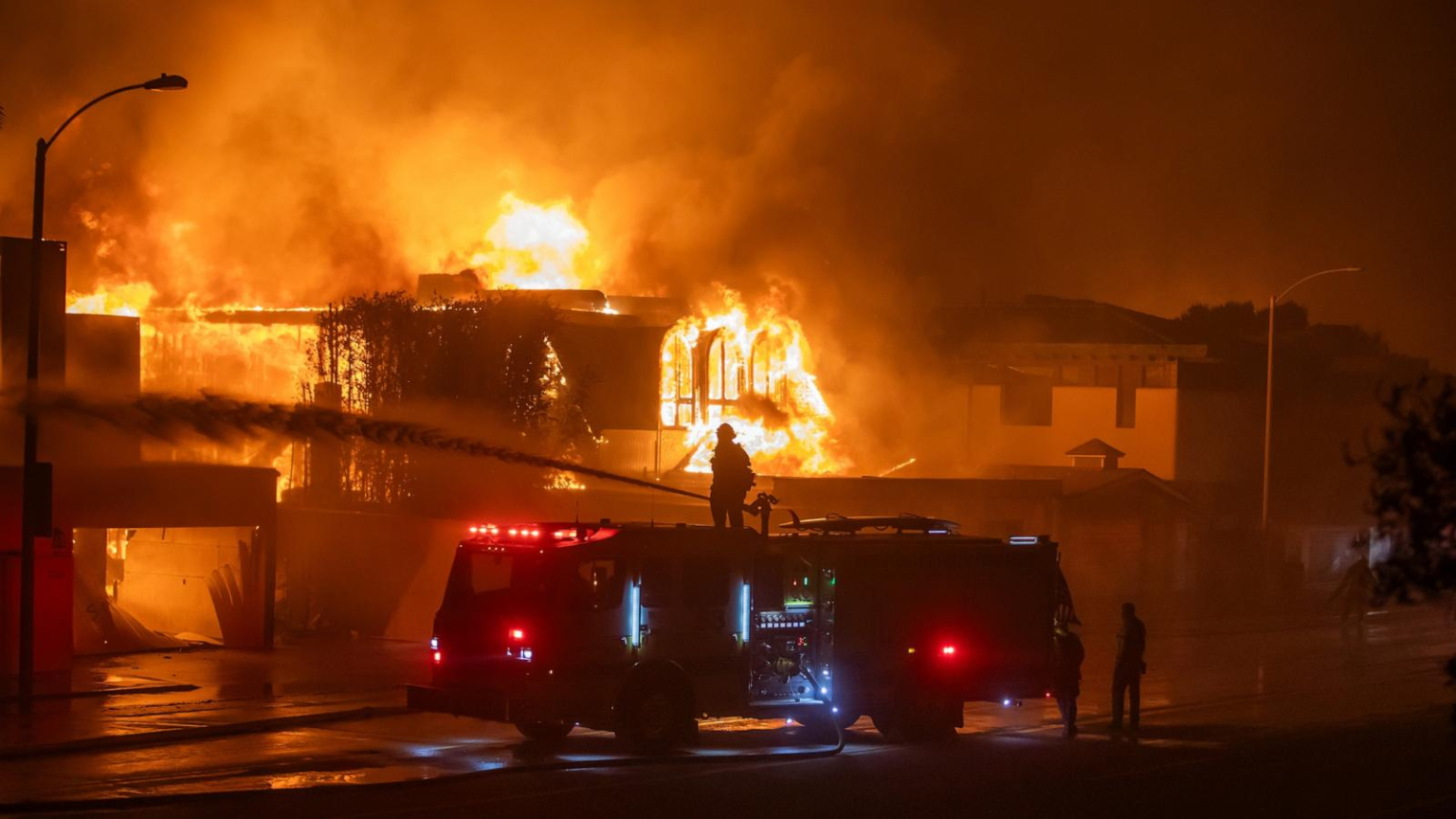 Universal Studios Hollywood Shuts Down Due to California Wildfires Firefighters battle the Palisades Fire on Wednesday in Los Angeles, Southern California. (Credit: Apu Gomes, Getty Images)