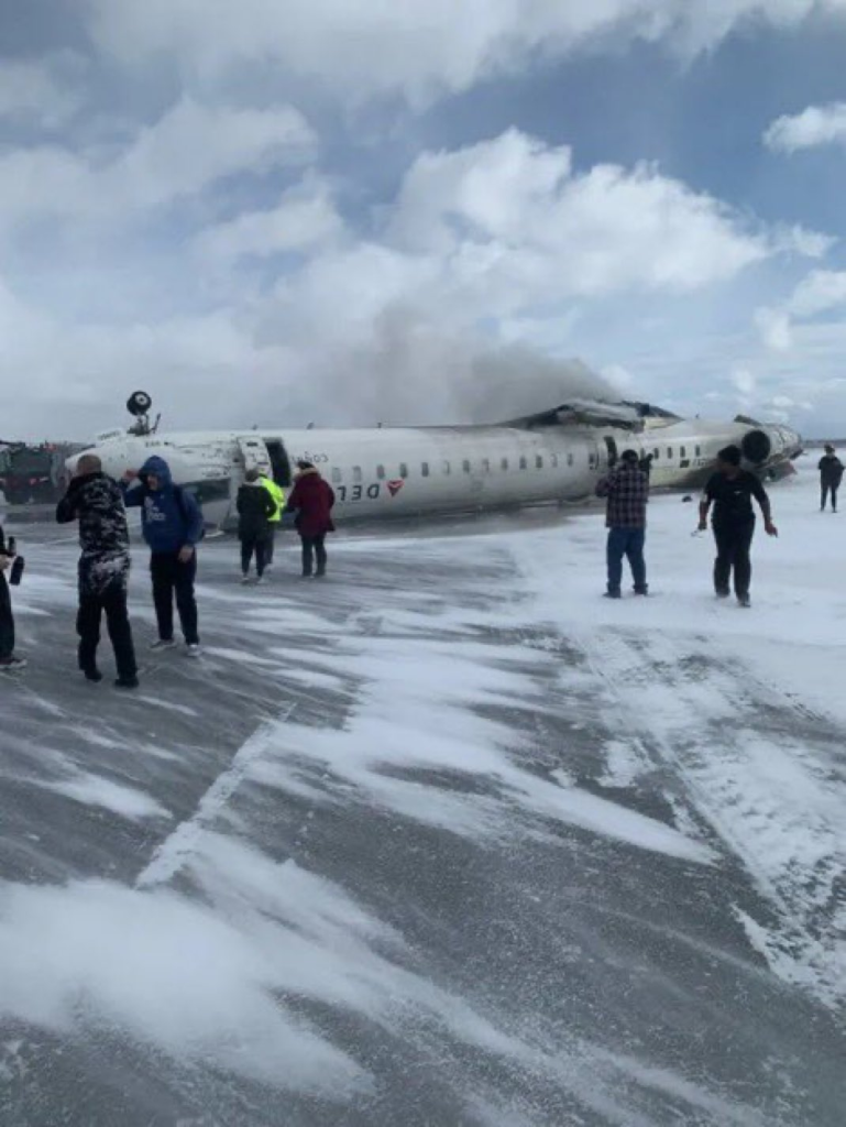Delta Plane Crash at Toronto: All Passengers Rescued 1 The Delta 4819 crash upside down in Toronto, but fortunately, only 18 passengers were injured. (Image Credit: AP)