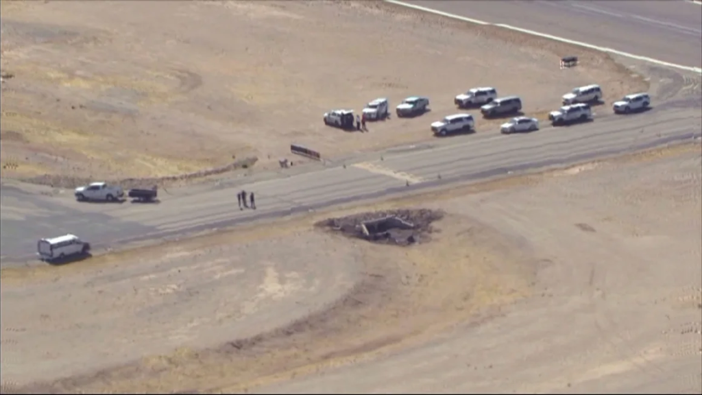 Law enforcement respond to the scene of the plane crash on Wednesday at Marana Regional Airport in Arizona. (Image Credit: KNXV / AP)