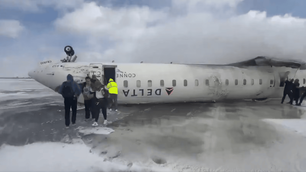 Delta Plane Crash at Toronto: All Passengers Rescued Delta Airlines plane flipped upside down upon its landing at the Toronto Pearson airport in Ontario. (Image Credit: Twitter / X @ErrolWebber)