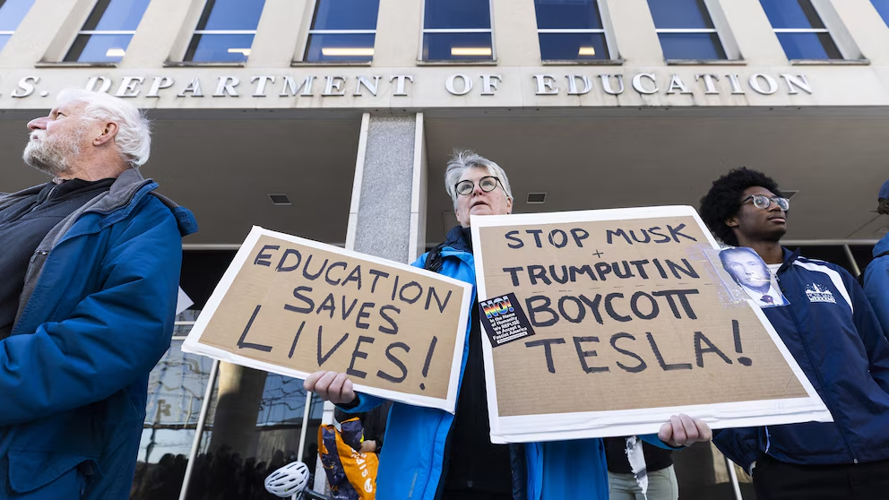 Civil servants and supporters rally outside the Department of Education to protest the education department staff reductions policy in Washington, Mar. 11, 2025. (Image Credit: Jim Lo Scalzo / Shutterstock)