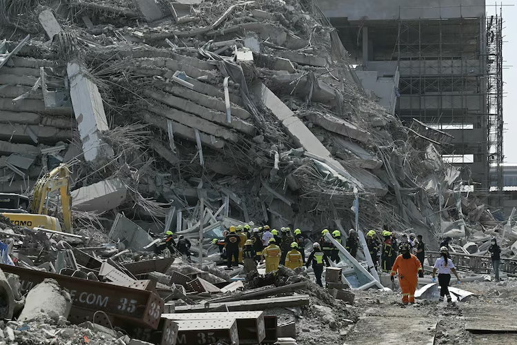 Rescue teams seen at a construction site where a building collapsed after an earthquake in Thailand, Mar. 28, 2025. (Image Credit: AFP)