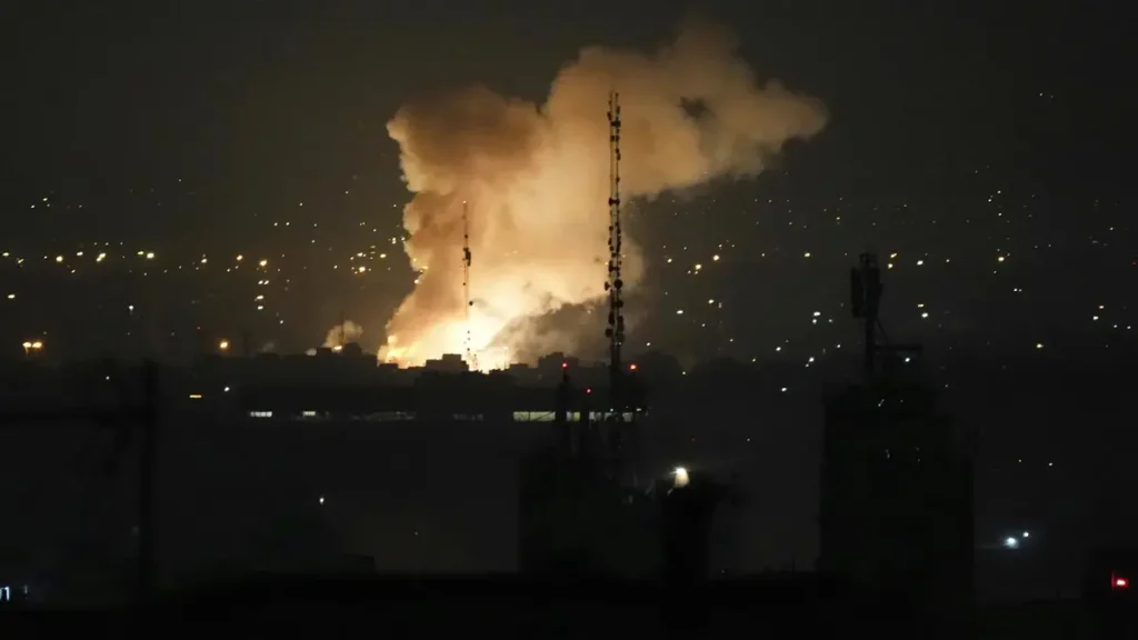 Israel Attack Iran’s Nuclear Sites and Military Leadership Security camera captured smoke rises up after Israel attack Iran's Capital, Tehran on Friday, June 13, 2025. (Image Credit: Vahid Salemi / AP)