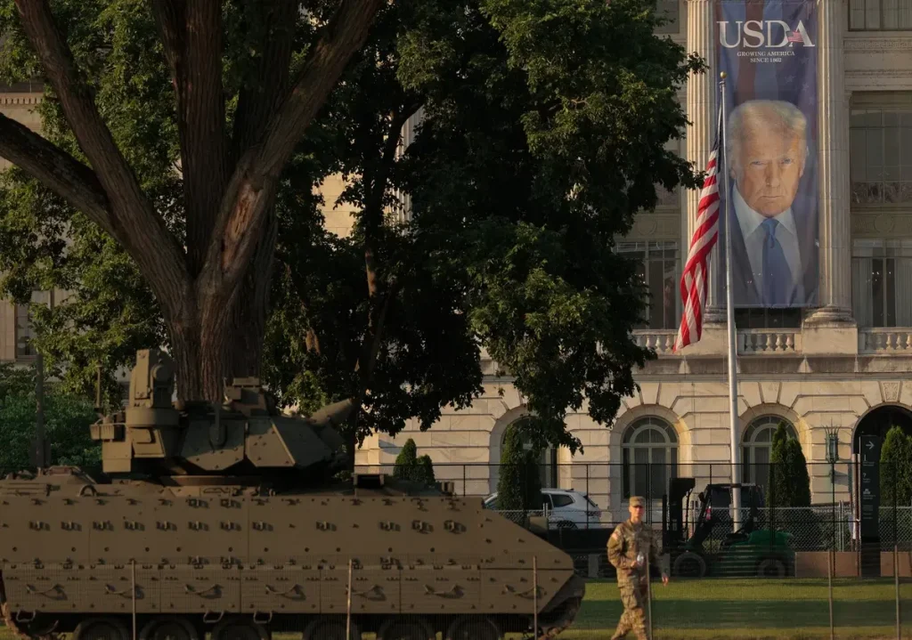 When and Where Is the Military Parade in DC Tomorrow? Banner of President Donald Trump hangs ahead of this weekend's Military Parade in Washington, DC. (Credit: Chip Somodevilla/Getty Images)