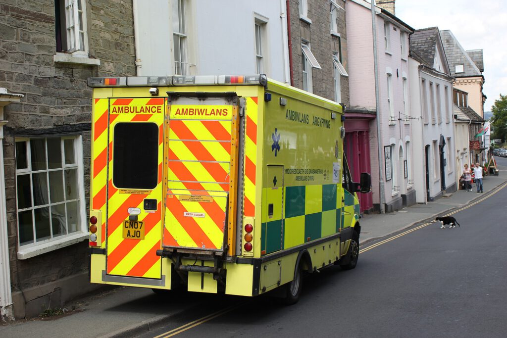 83-Year-Old Cancer Patient Drives 4 Hours for Heart Tests A rural road in Wales leading to a hospital building