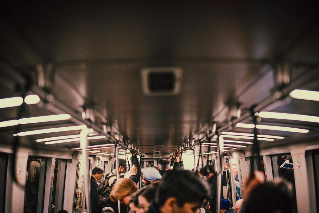 Andy Burnham's Headphone Fines: Do They Work? 1 interior crowded subway train