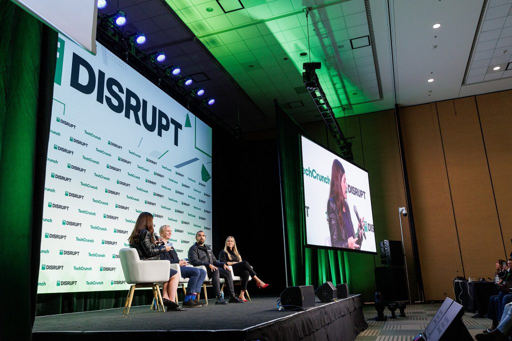Venture capital partners discussing investment conflicts in a modern office setting